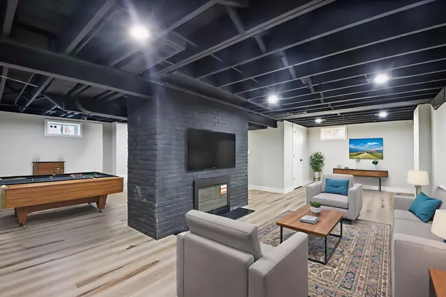 a living room with fireplace furniture and a flat screen tv