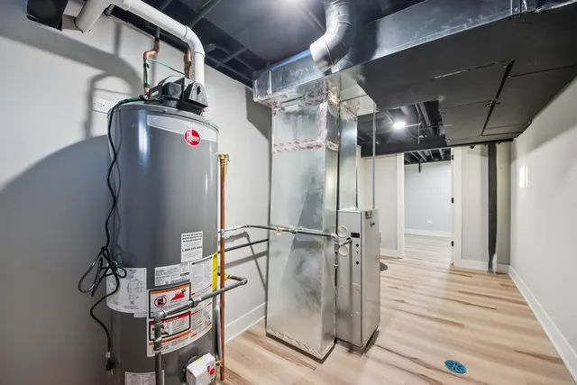 a front view of a house with a snow on the road