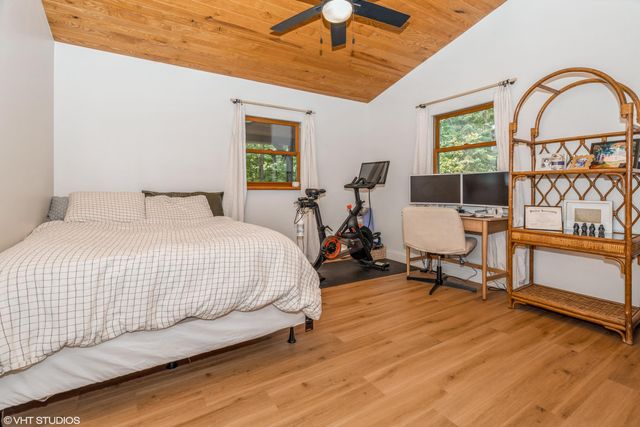 a bed room with a bed and a window