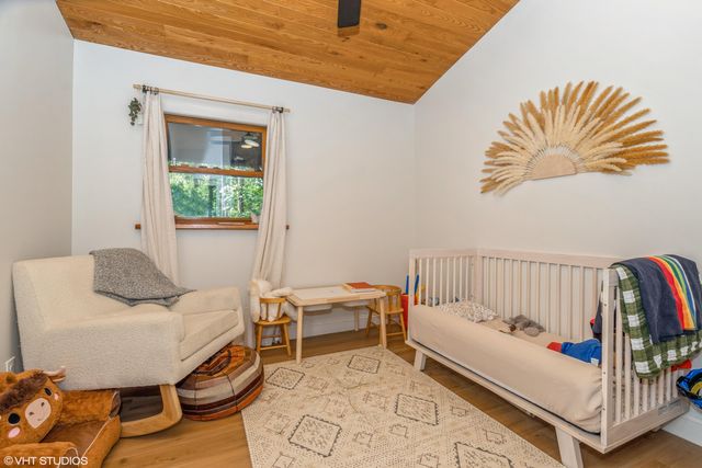 a bedroom with furniture and a window