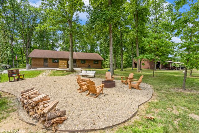 swimming pool view with a seating space