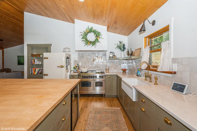 a kitchen with a sink stove and refrigerator