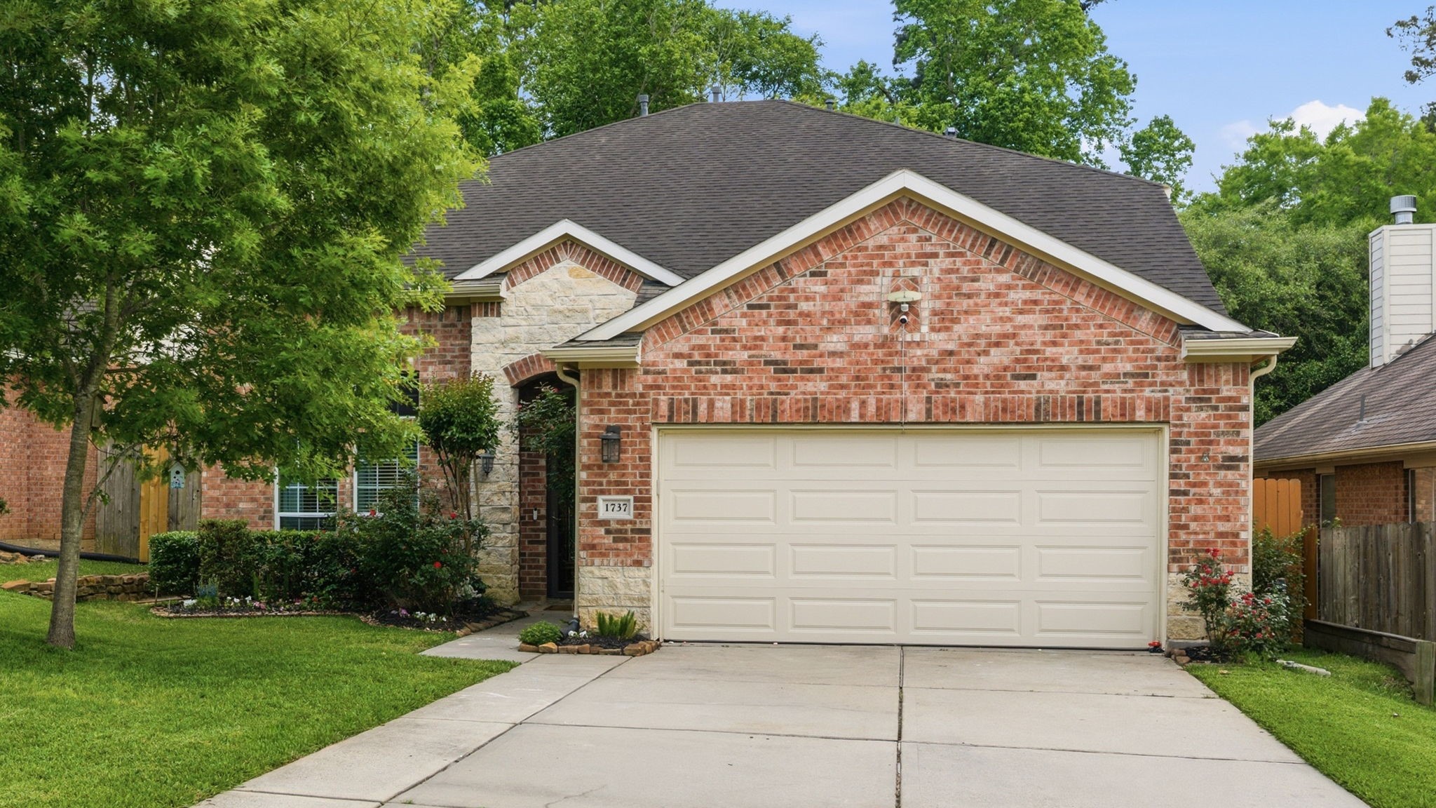 1737 Round Oak Lane Conroe, TX 77304 - Photo 25 of 39 a view of a house with a garage