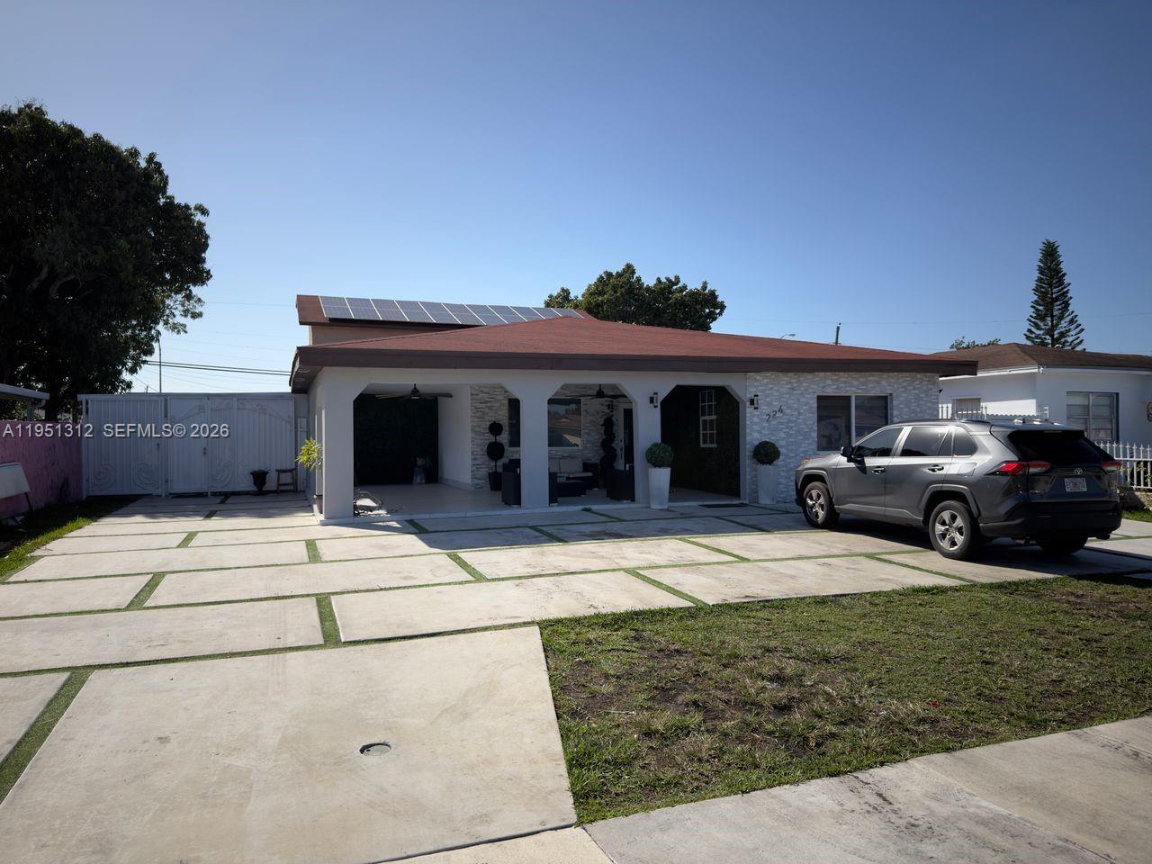 a front view of a house with garden