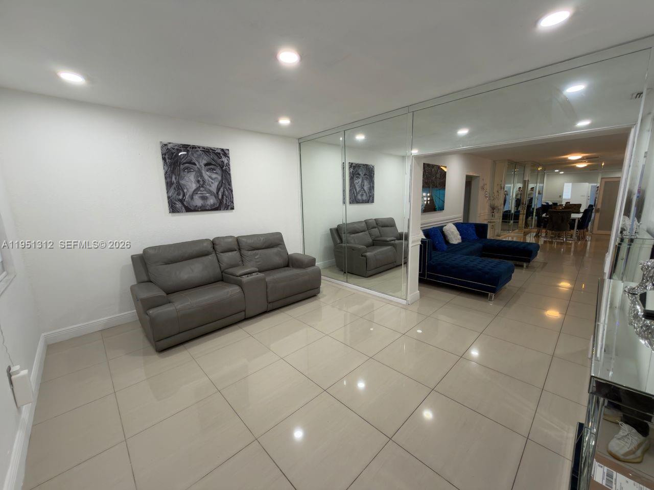 224 East 42nd Street Hialeah, FL 33013 - Photo 15 of 59 a living room with furniture and a view of kitchen