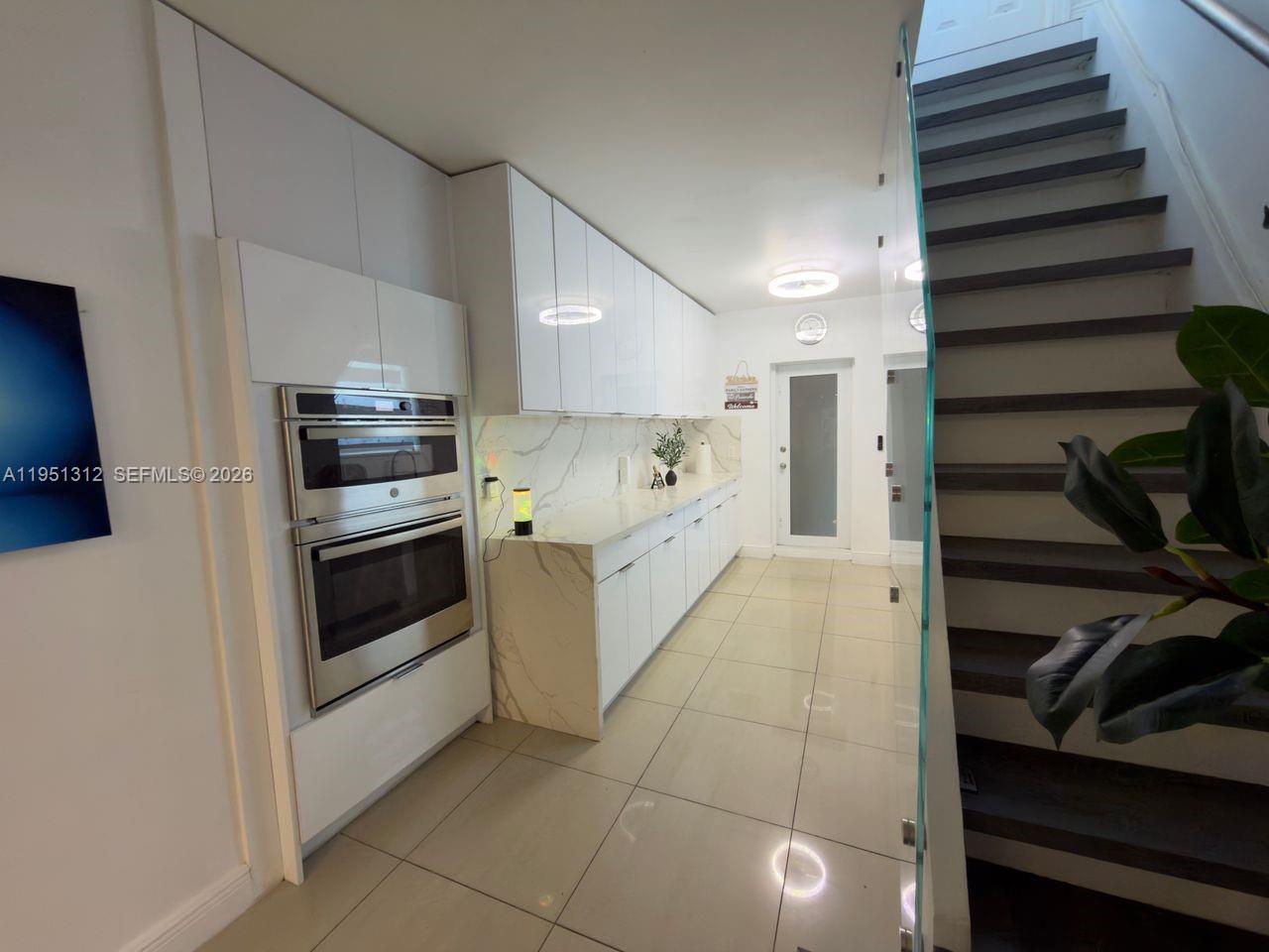 224 East 42nd Street Hialeah, FL 33013 - Photo 23 of 59 a kitchen with cabinets and oven