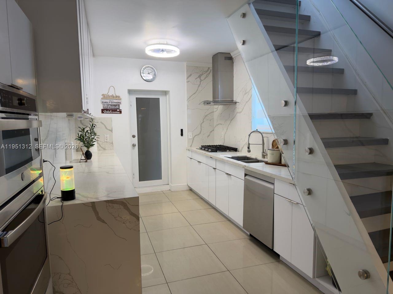 224 East 42nd Street Hialeah, FL 33013 - Photo 24 of 59 a kitchen with stainless steel appliances a refrigerator and a stove