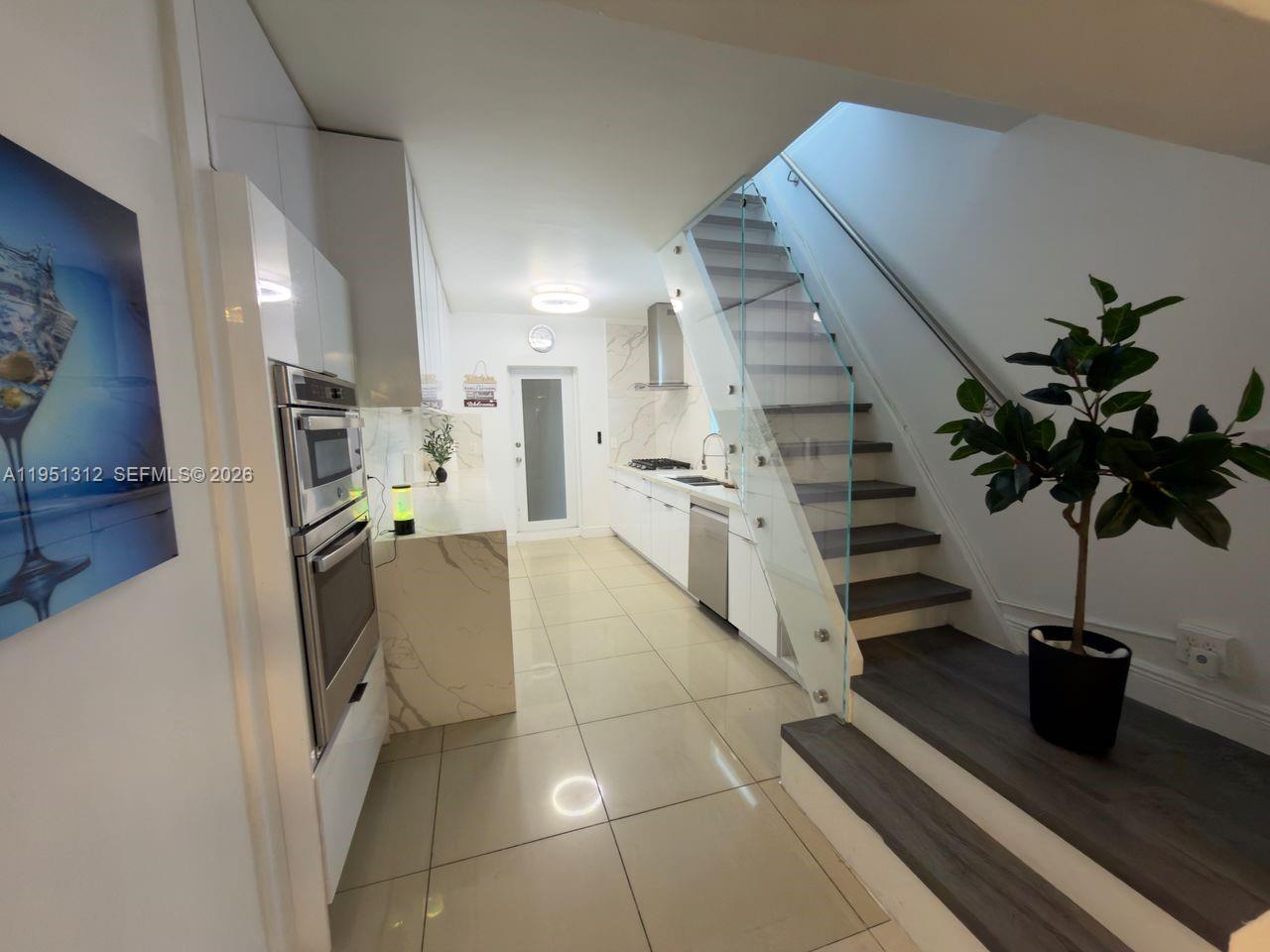 224 East 42nd Street Hialeah, FL 33013 - Photo 25 of 59 a view of entryway and hall with wooden floor