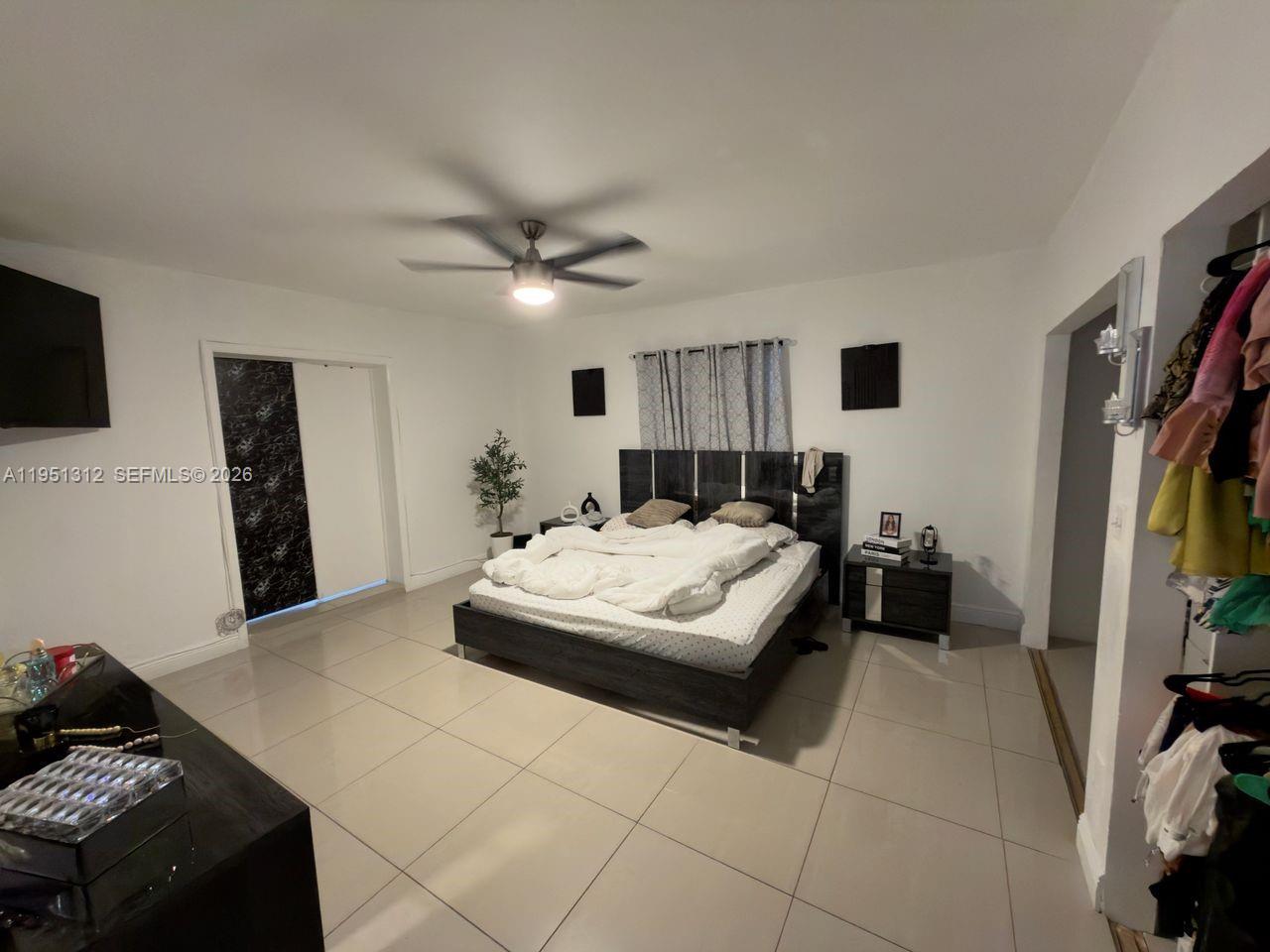 224 East 42nd Street Hialeah, FL 33013 - Photo 30 of 59 a living room with furniture and a flat screen tv