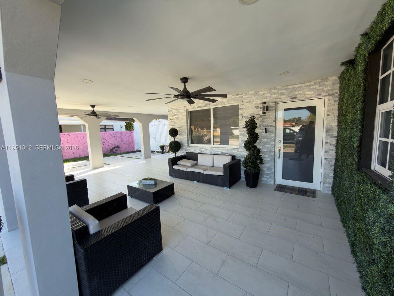 224 East 42nd Street Hialeah, FL 33013 - Photo 4 of 59 a living room with furniture and a flat screen tv