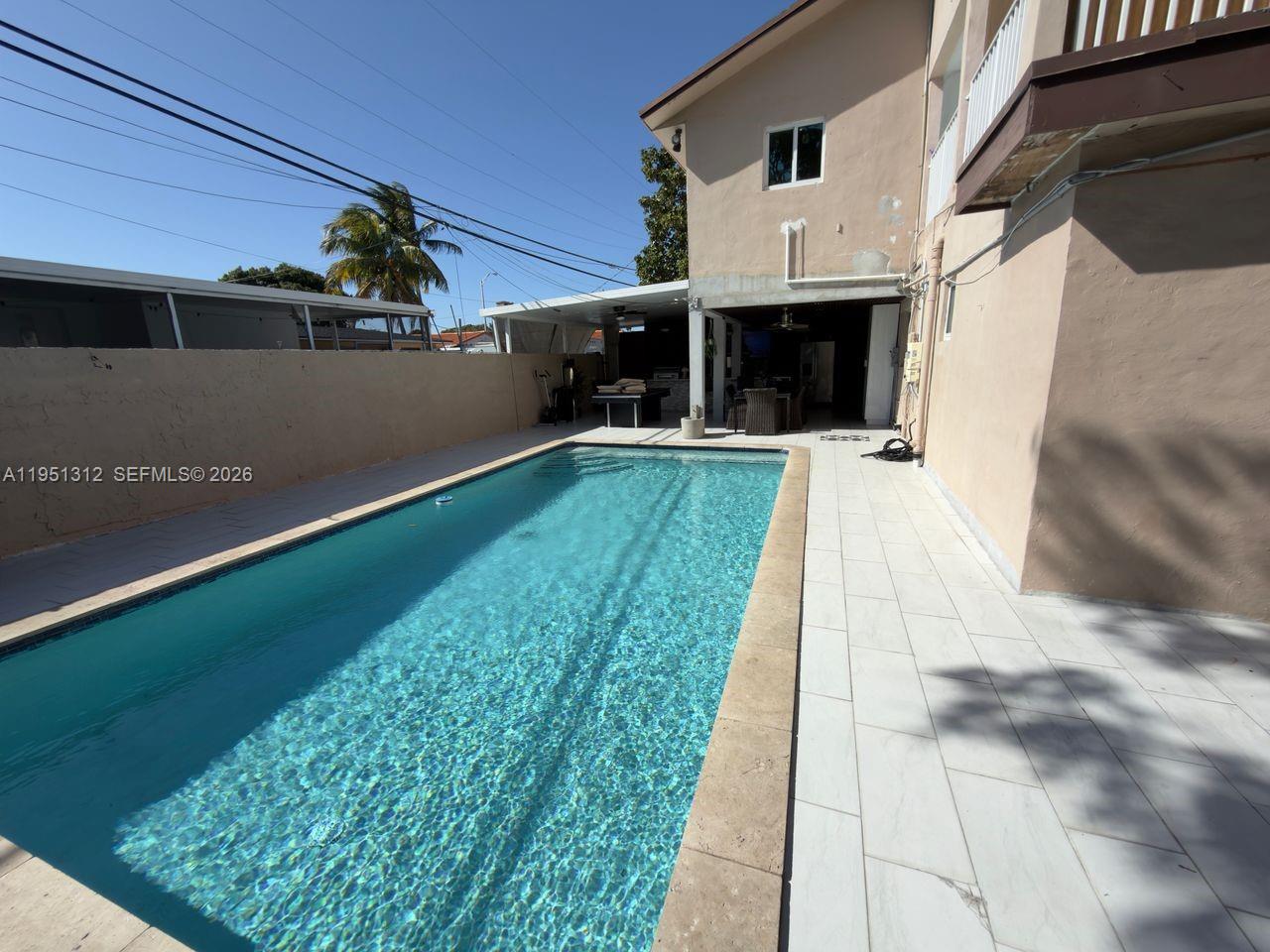 224 East 42nd Street Hialeah, FL 33013 - Photo 50 of 59 a front view of a house with a yard