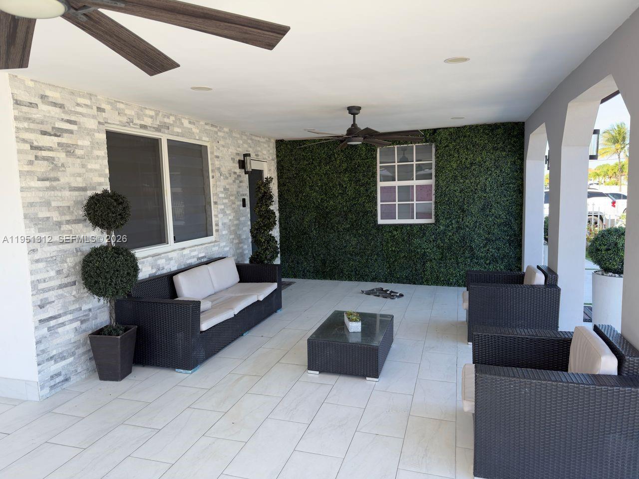224 East 42nd Street Hialeah, FL 33013 - Photo 5 of 59 a living room with furniture and a large window