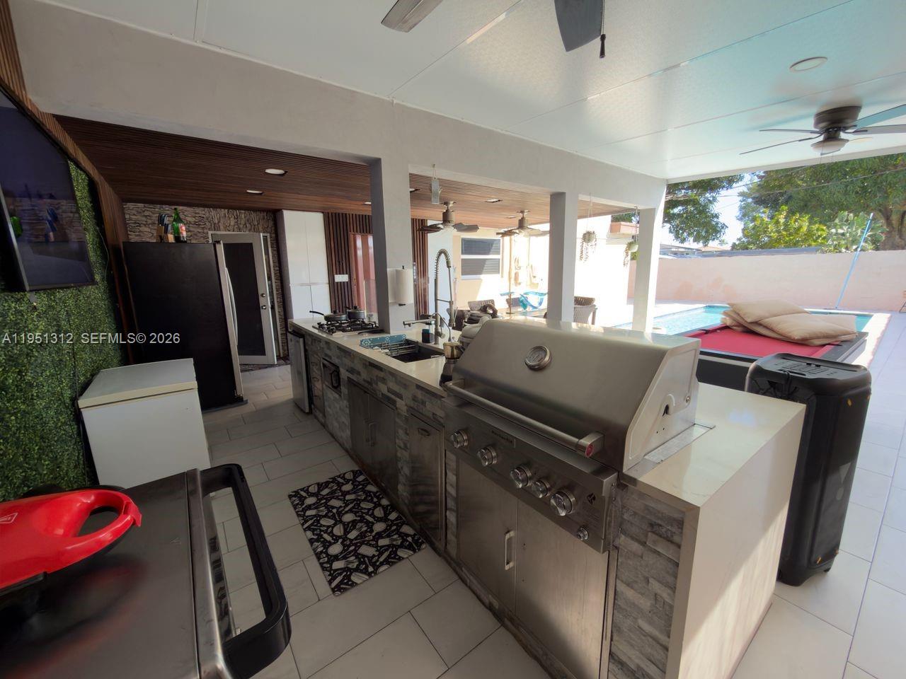 224 East 42nd Street Hialeah, FL 33013 - Photo 53 of 59 a living room with furniture fireplace and flat screen tv