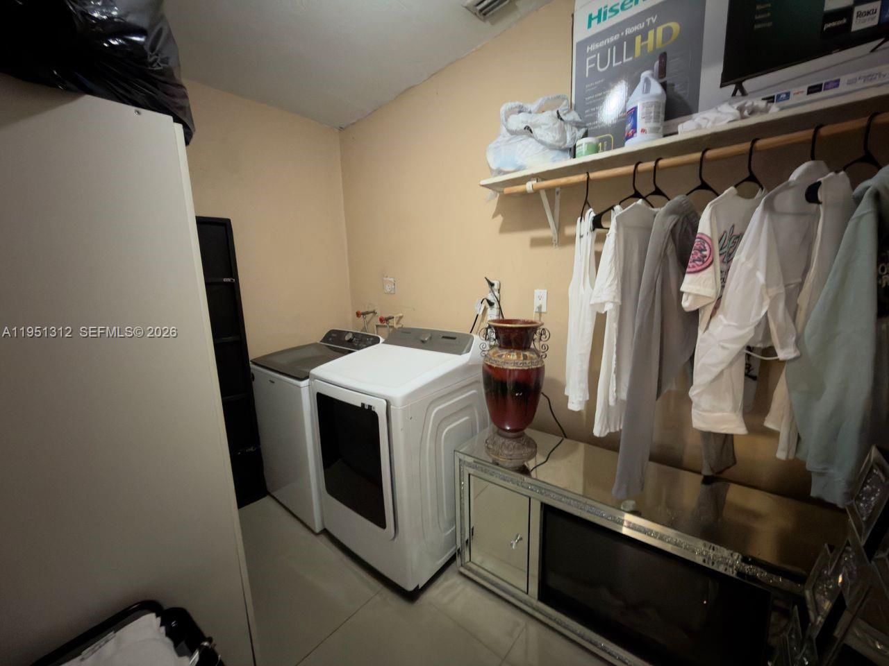 224 East 42nd Street Hialeah, FL 33013 - Photo 59 of 59 a utility room with dryer and washer