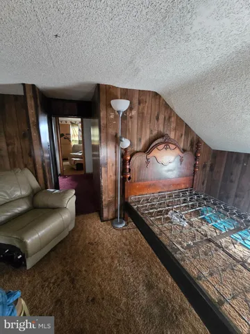 a living room with lots of furniture and a rug
