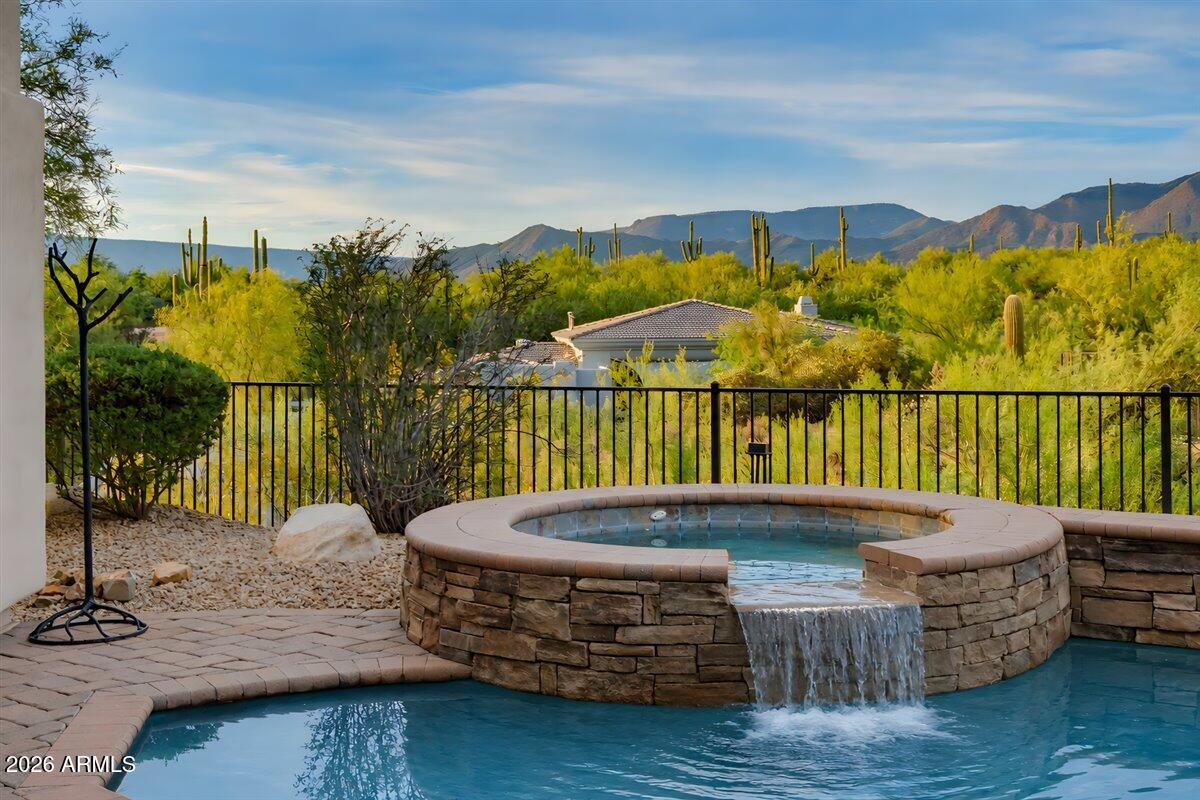 6880 East Stevens Road Cave Creek, AZ 85331 - Photo 27 of 39 Heated spa and pool with mountain views