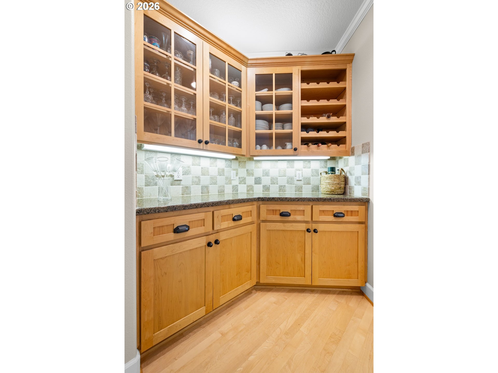 2633 Southeast Vista Way Gresham, OR 97080 - Photo 12 of 48 a view of cabinet with granite countertop