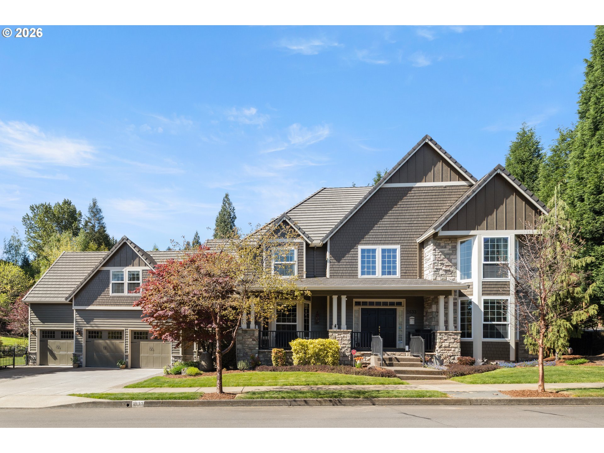 2633 Southeast Vista Way Gresham, OR 97080 - Photo 2 of 48 a front view of a house with a yard