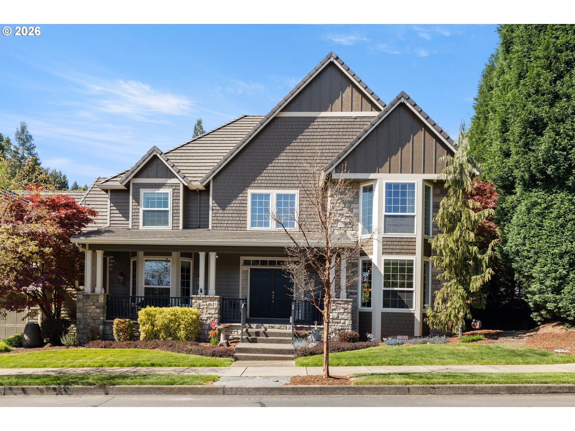 2633 Southeast Vista Way Gresham, OR 97080 - Photo 3 of 48 a front view of a house with a yard