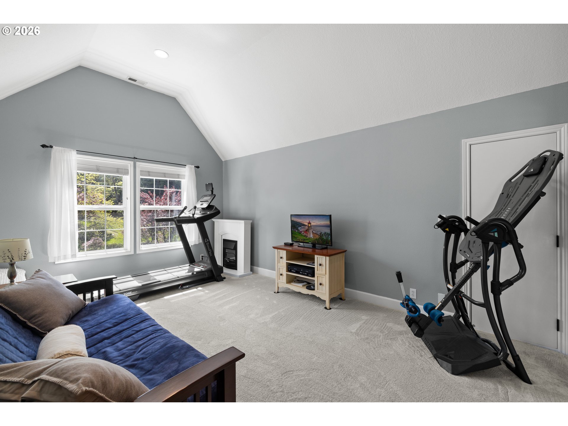 2633 Southeast Vista Way Gresham, OR 97080 - Photo 31 of 48 a living room with furniture a window and gym equipment