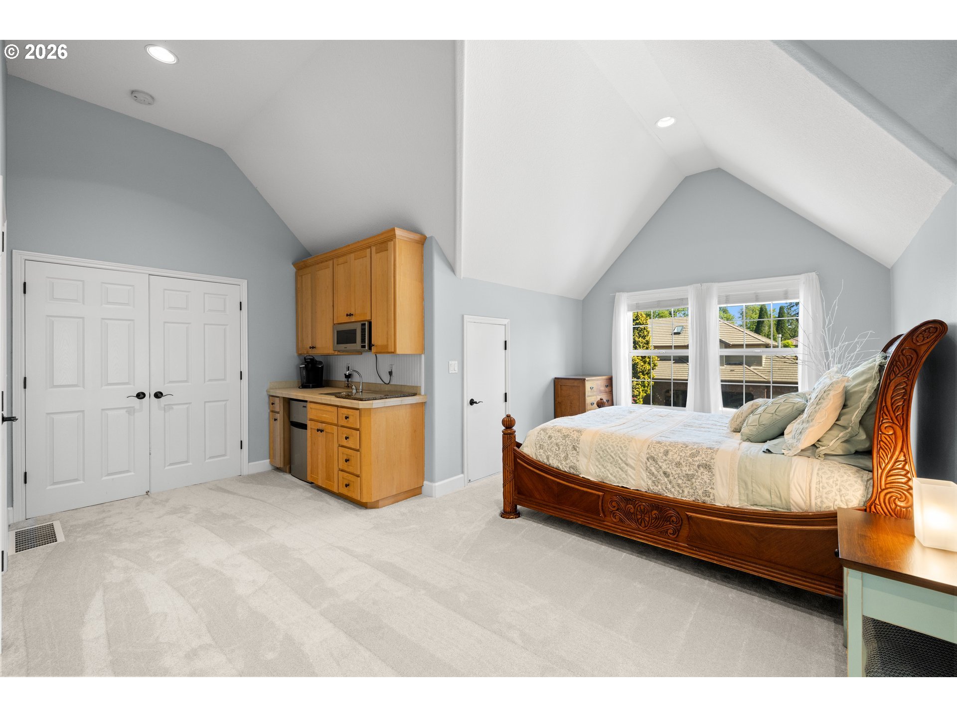 2633 Southeast Vista Way Gresham, OR 97080 - Photo 32 of 48 a bedroom with a bed and large windows