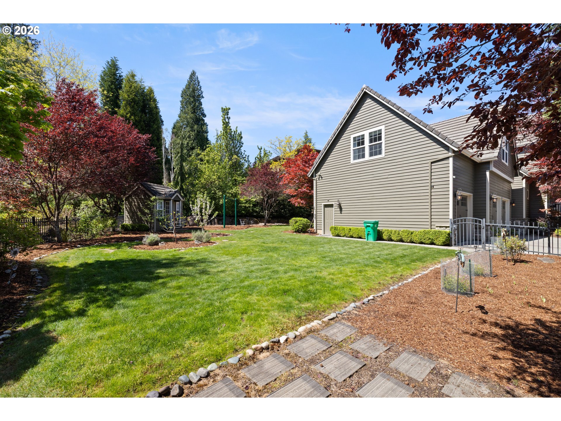 2633 Southeast Vista Way Gresham, OR 97080 - Photo 33 of 48 a view of a backyard with a garden and plants