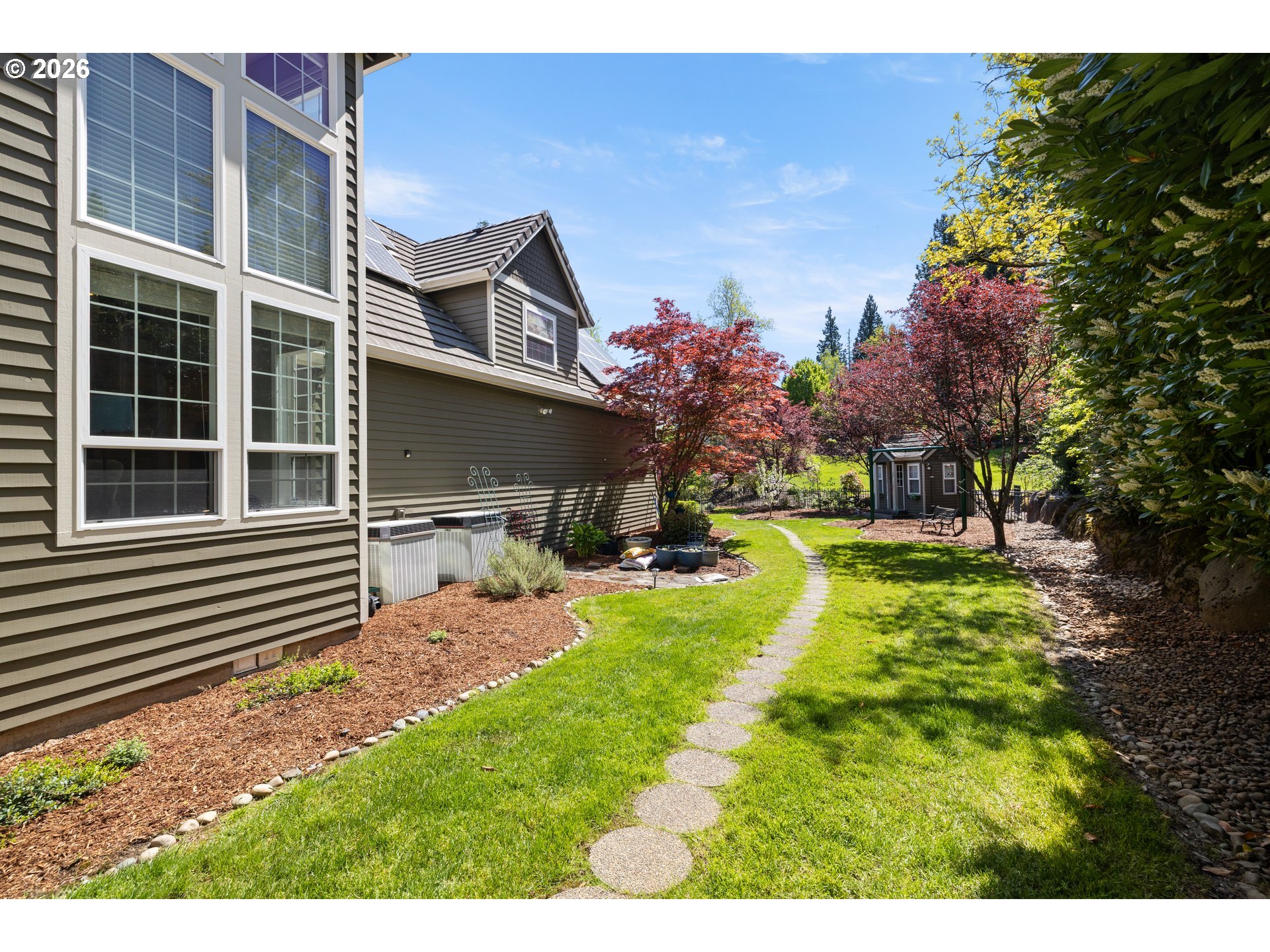 2633 Southeast Vista Way Gresham, OR 97080 - Photo 37 of 48 a view of a house with backyard and sitting area