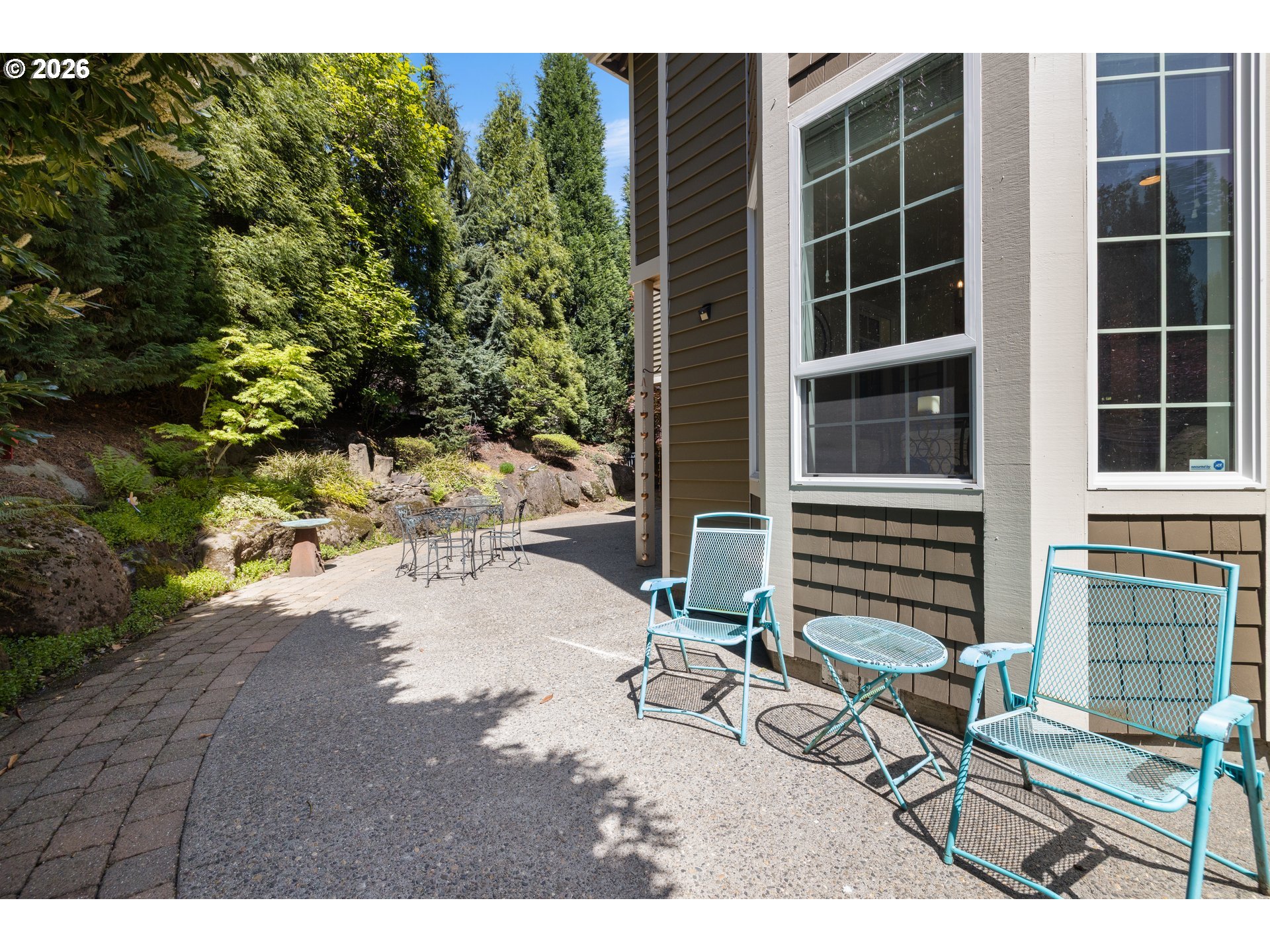 2633 Southeast Vista Way Gresham, OR 97080 - Photo 38 of 48 a backyard of a house with yard and outdoor seating
