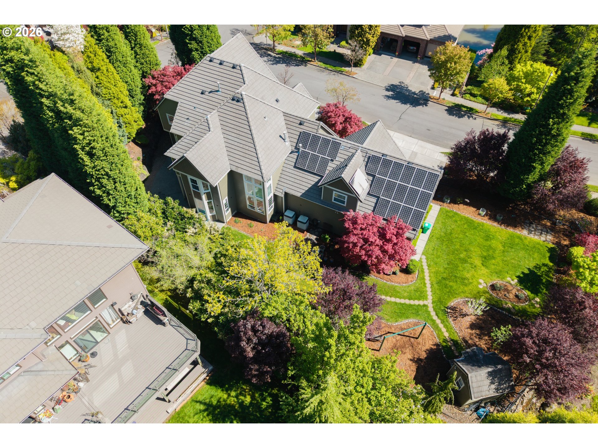 2633 Southeast Vista Way Gresham, OR 97080 - Photo 44 of 48 an aerial view of a house with a yard and garden