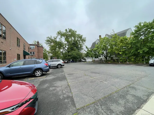 a view of car parked in front of a building