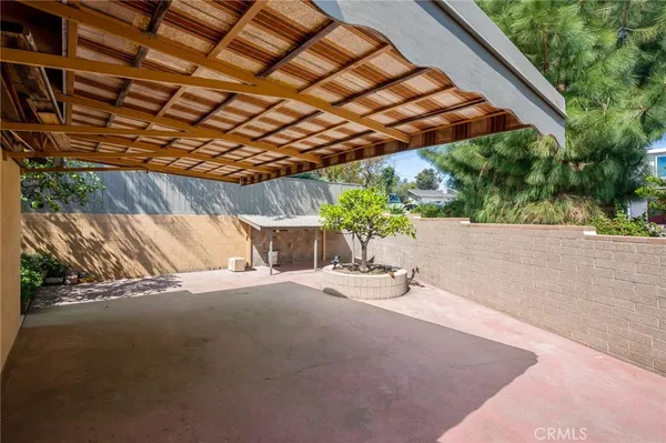 a view of balcony with two chairs and a table