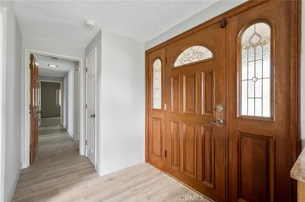 a view of entryway with wooden floor