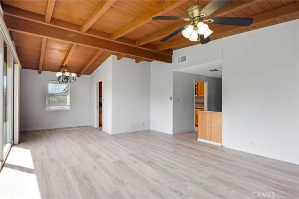 a view of hallway with wooden floor