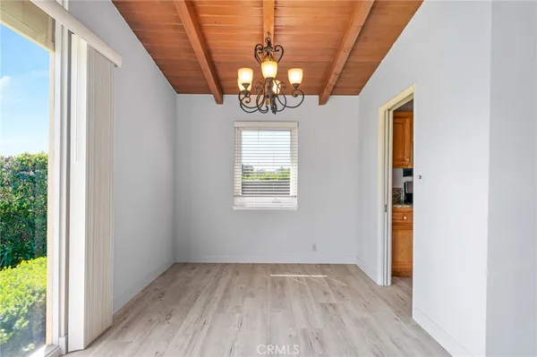 a view of entryway with window and wooden floor
