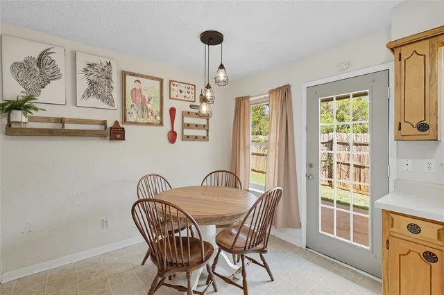 a dining room with furniture and window