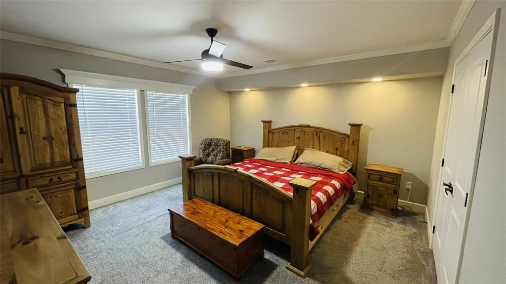 8394 Lake Road Mansfield, TX 76063 - Photo 15 of 22 a bedroom with a bed and furniture