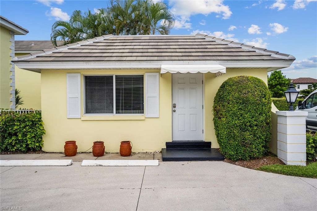 4155 Crayton Road, Unit 201 Naples, FL 34103 - Photo 21 of 24 a view of a entryway front of house