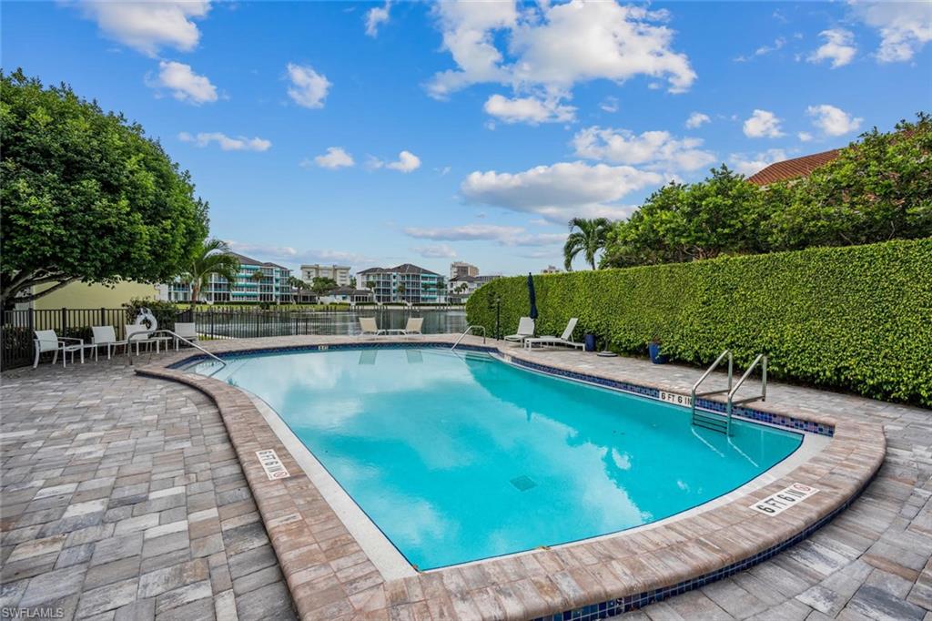 4155 Crayton Road, Unit 201 Naples, FL 34103 - Photo 23 of 24 a view of a swimming pool and outdoor space