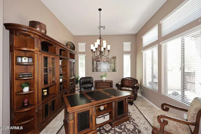 a dining room with furniture and window