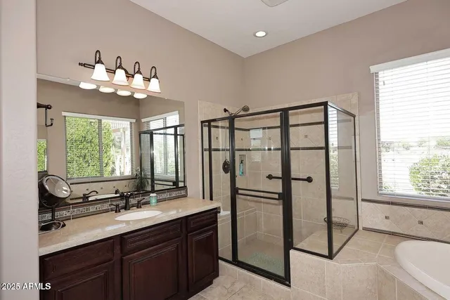 a kitchen with a counter space a sink appliances and a window