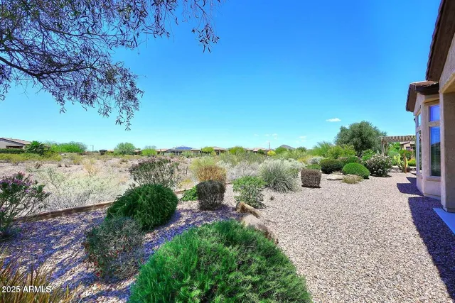 a view of a lake with beach and outdoor space