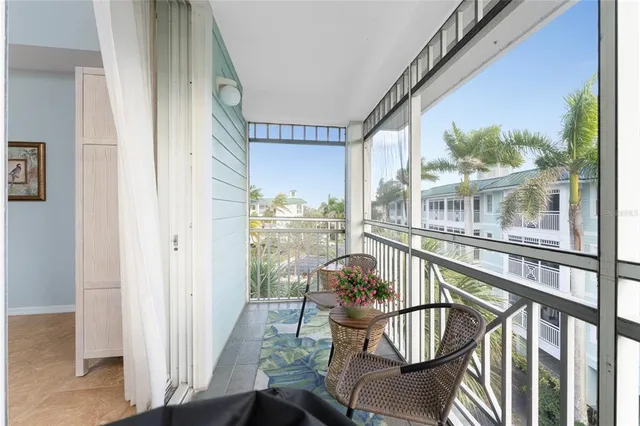 a view of a balcony with furniture