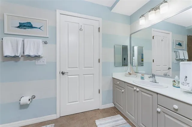 a bathroom with a double vanity sink a mirror and a shower