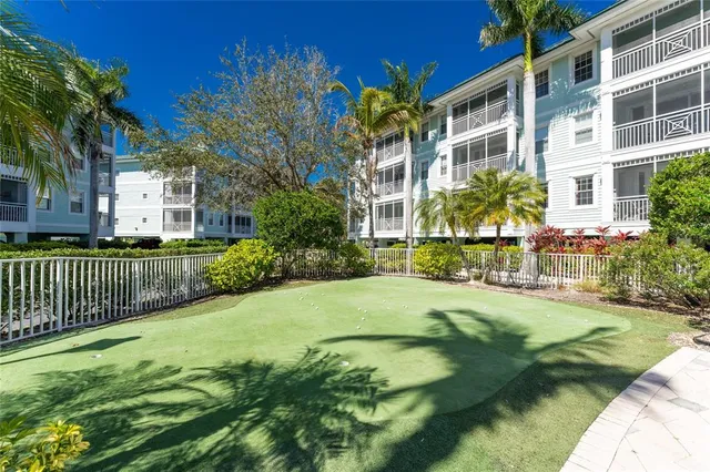 a view of a garden with a building in the background