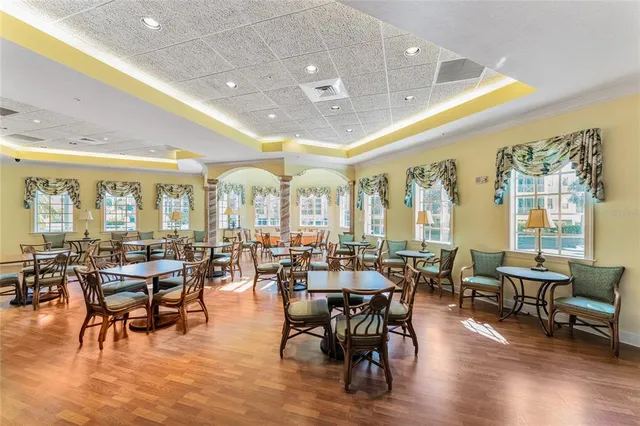 a living room with lots of furniture and painting on the wall
