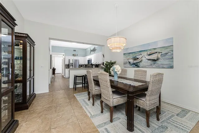 a view of a dining room and livingroom with furniture
