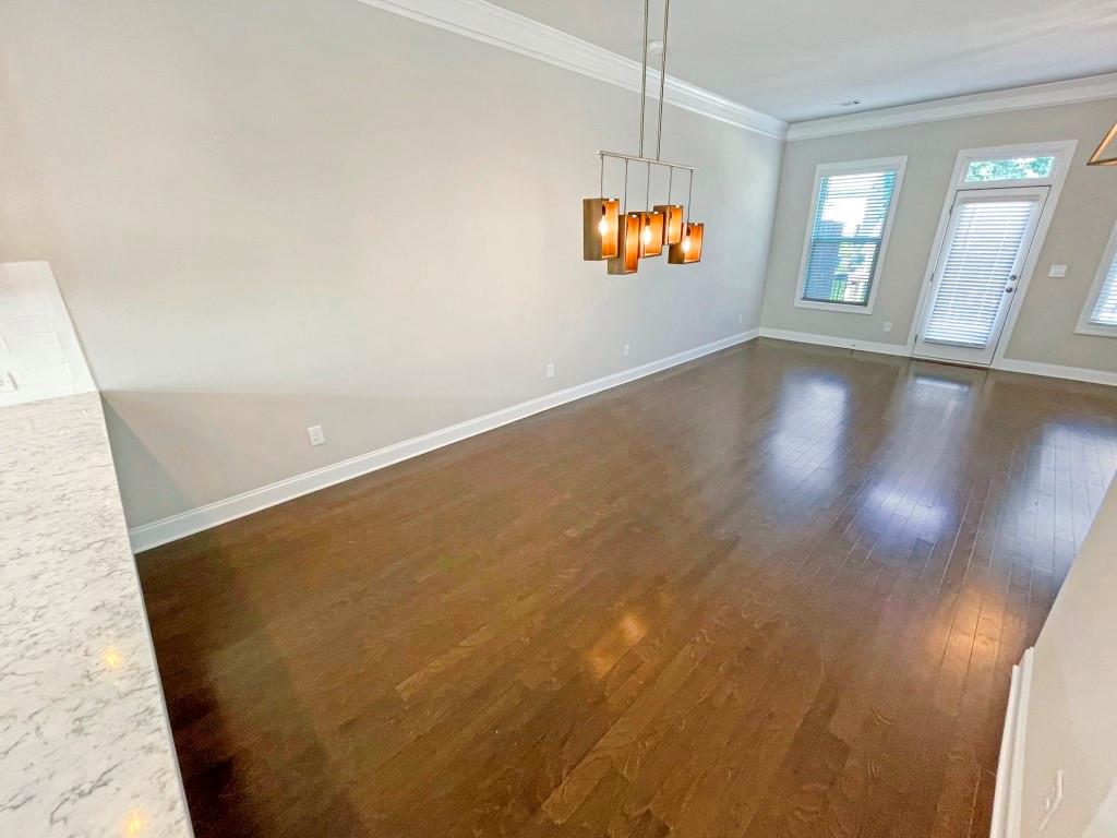 4129 Townsend Lane Dunwoody, GA 30346 - Photo 11 of 38 a view of an empty room with wooden floor and a window