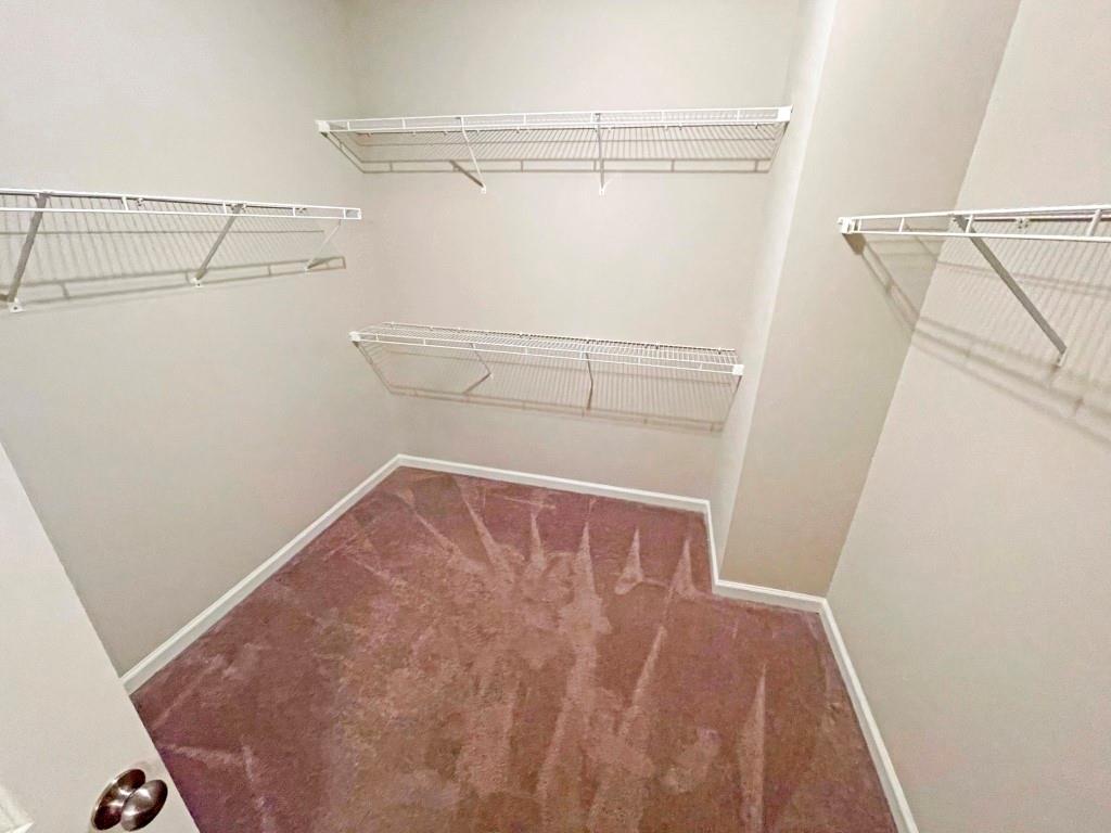 4129 Townsend Lane Dunwoody, GA 30346 - Photo 24 of 38 a view of walk in closet with empty racks
