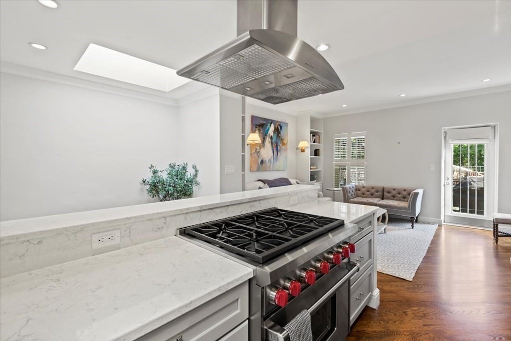 a stove top oven sitting inside of a kitchen