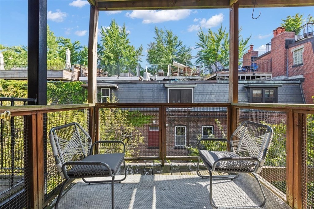 54 Appleton Street, Unit 4 Boston, MA 02116 - Photo 12 of 20 a view of a balcony with chairs and a table